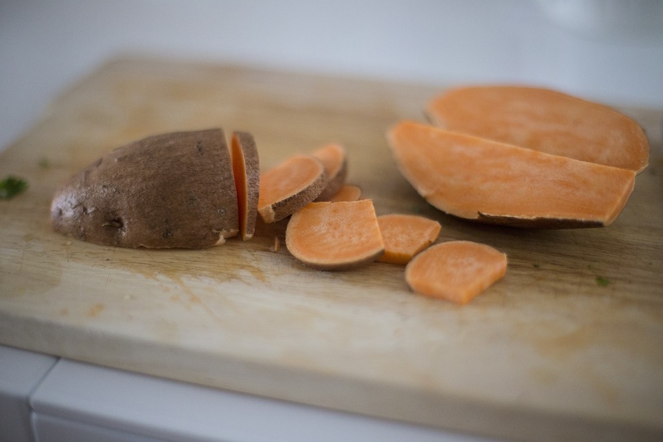 Sweet potatoes being prepared for Thanksgiving dishes.